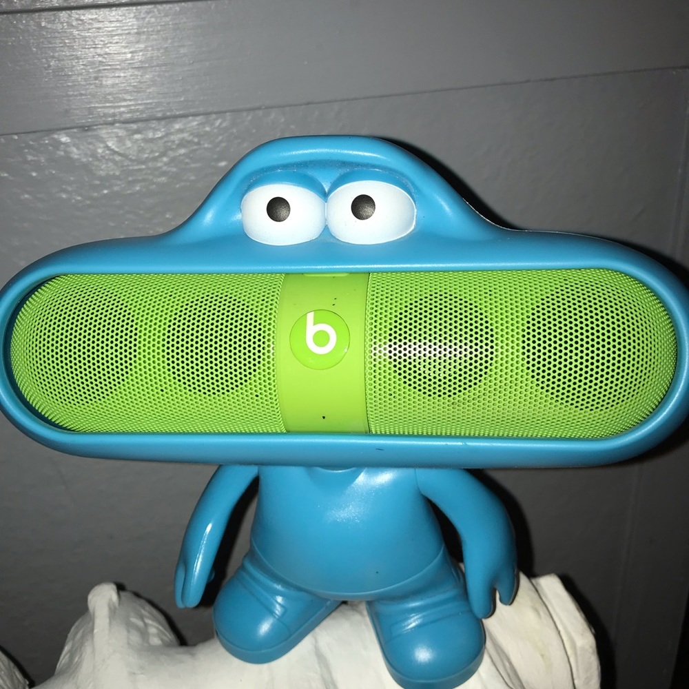 Green Beats pill with blue dude stand